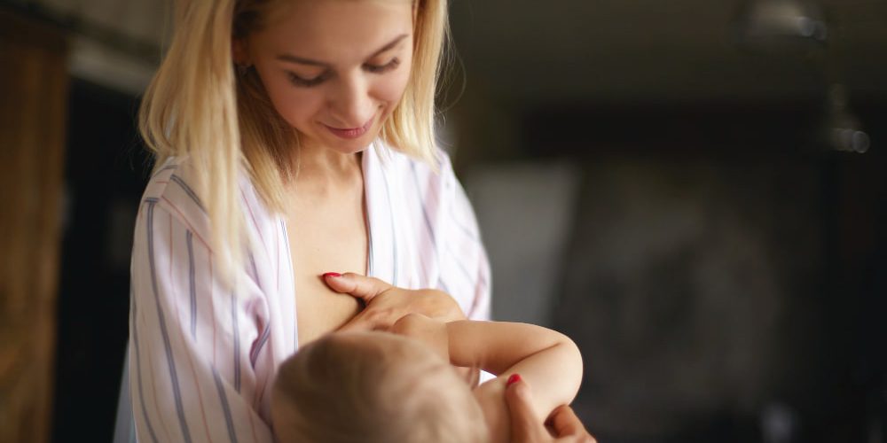 Can You Breastfeed After A Boob Job? Here's What The Experts Say