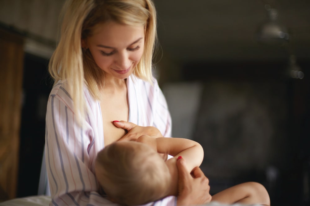 Can You Breastfeed After A Boob Job? Here's What The Experts Say